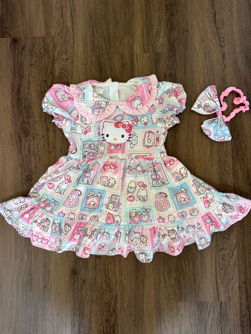 Hello Kitty Pink and Light Blue Ruffled Dress with Matching Bow